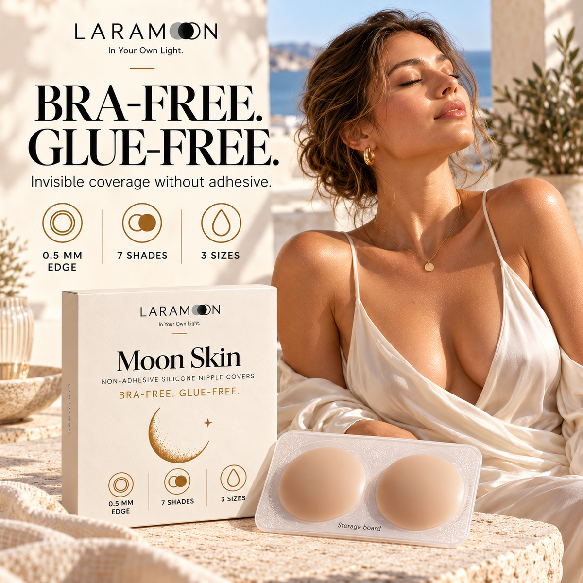 Laramoon Moon Skin non-adhesive silicone nipple covers on a storage board beside their packaging, with a model wearing a light satin outfit